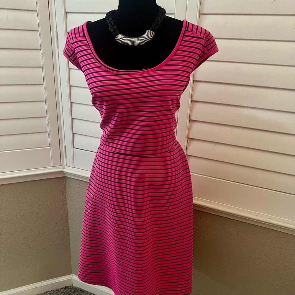 Torrid mini dress with crisscross back design.